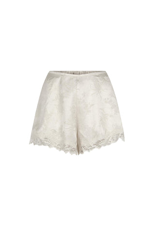 Off-white lace shorts with a subtle floral jacquard pattern and a scalloped lace hem, shown against a plain white background.