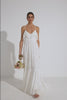 A video of model, Roberta Pecoraro, wearing Spell’s Novella Gown. The gown is made of a white, textured anglaise lace and features a neckline with frills, voluminous skirt, plunging neckline and open back with adjustable crossover ties.